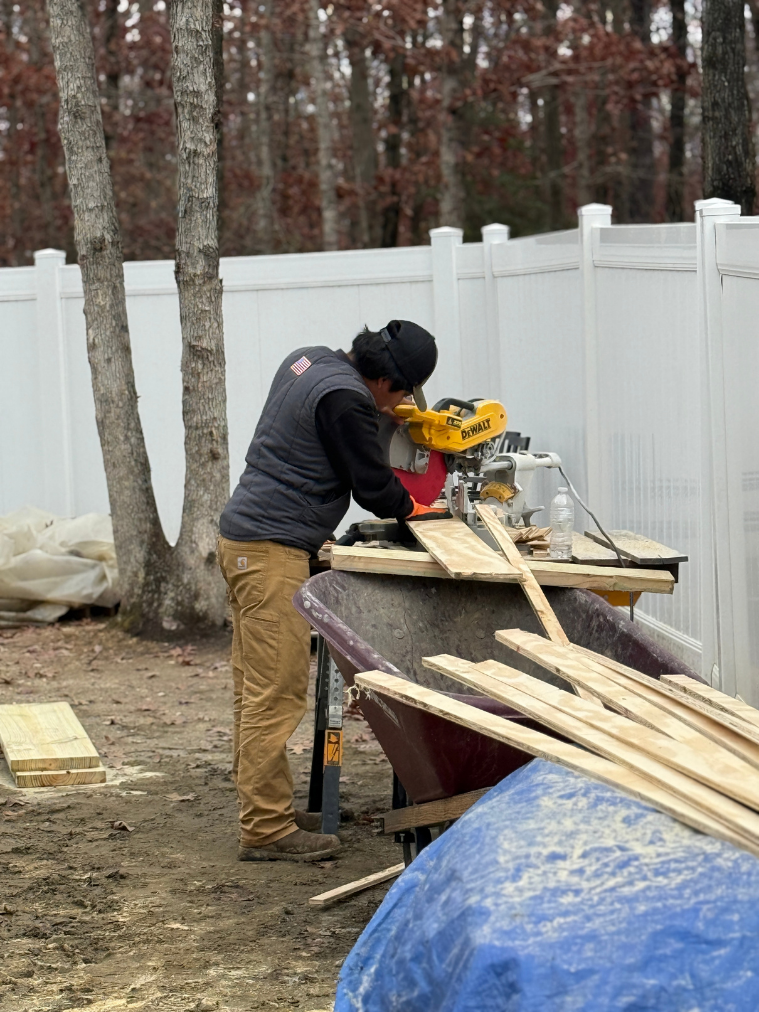 Cutting lumber with miter saw